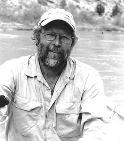 Black and White Photo of A Man with A Beard Wearing a Hat and Glasses
