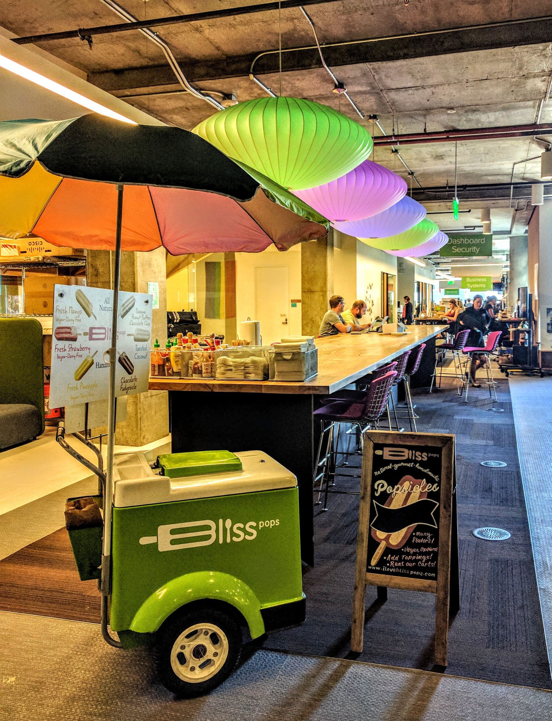An ice cream cart with bliss written on it