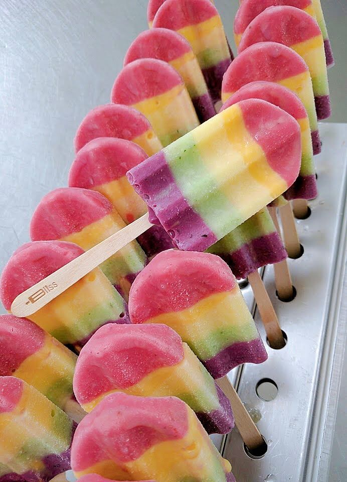 A row of ice pops with different flavors on them