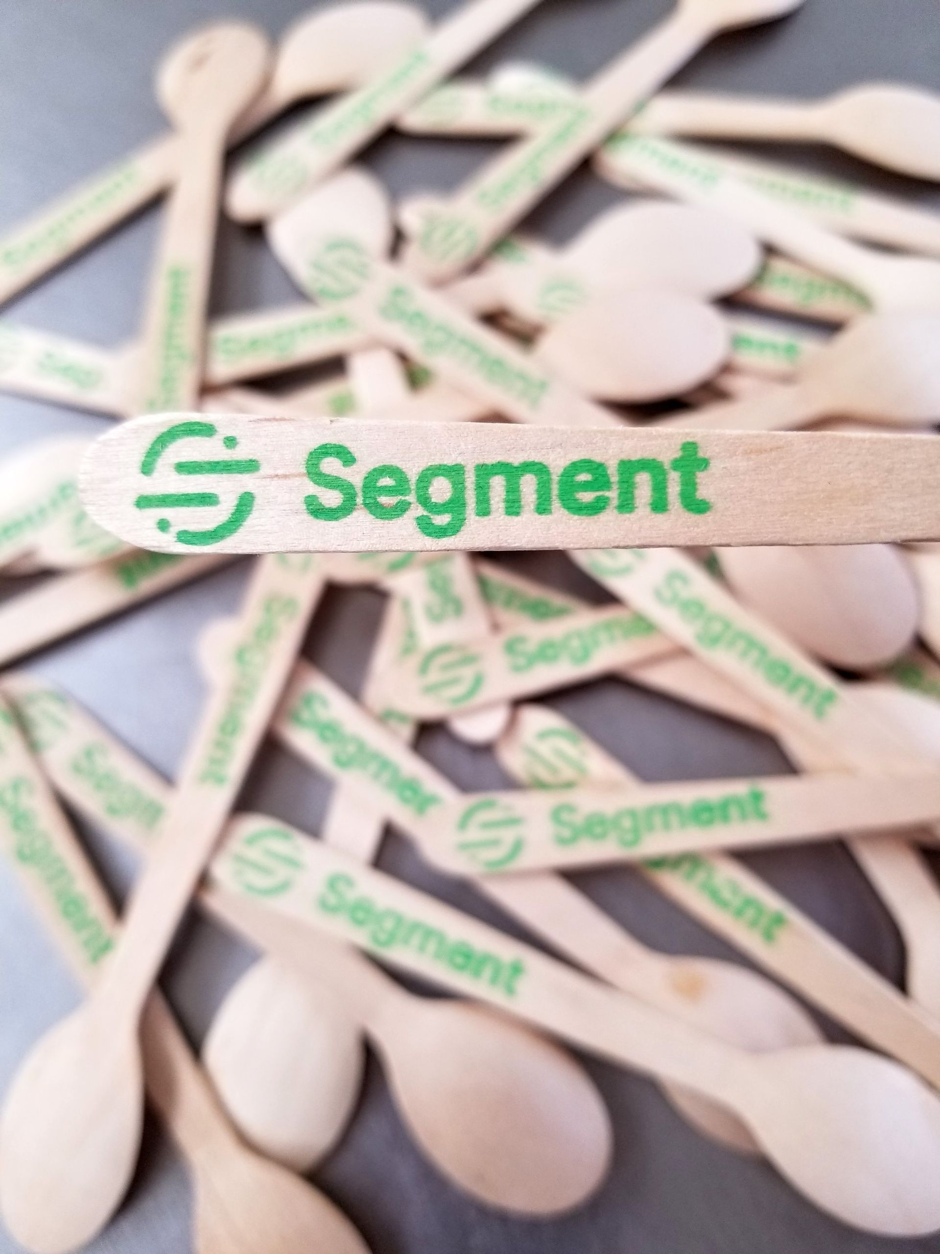 A bunch of wooden spoons with segment written on them