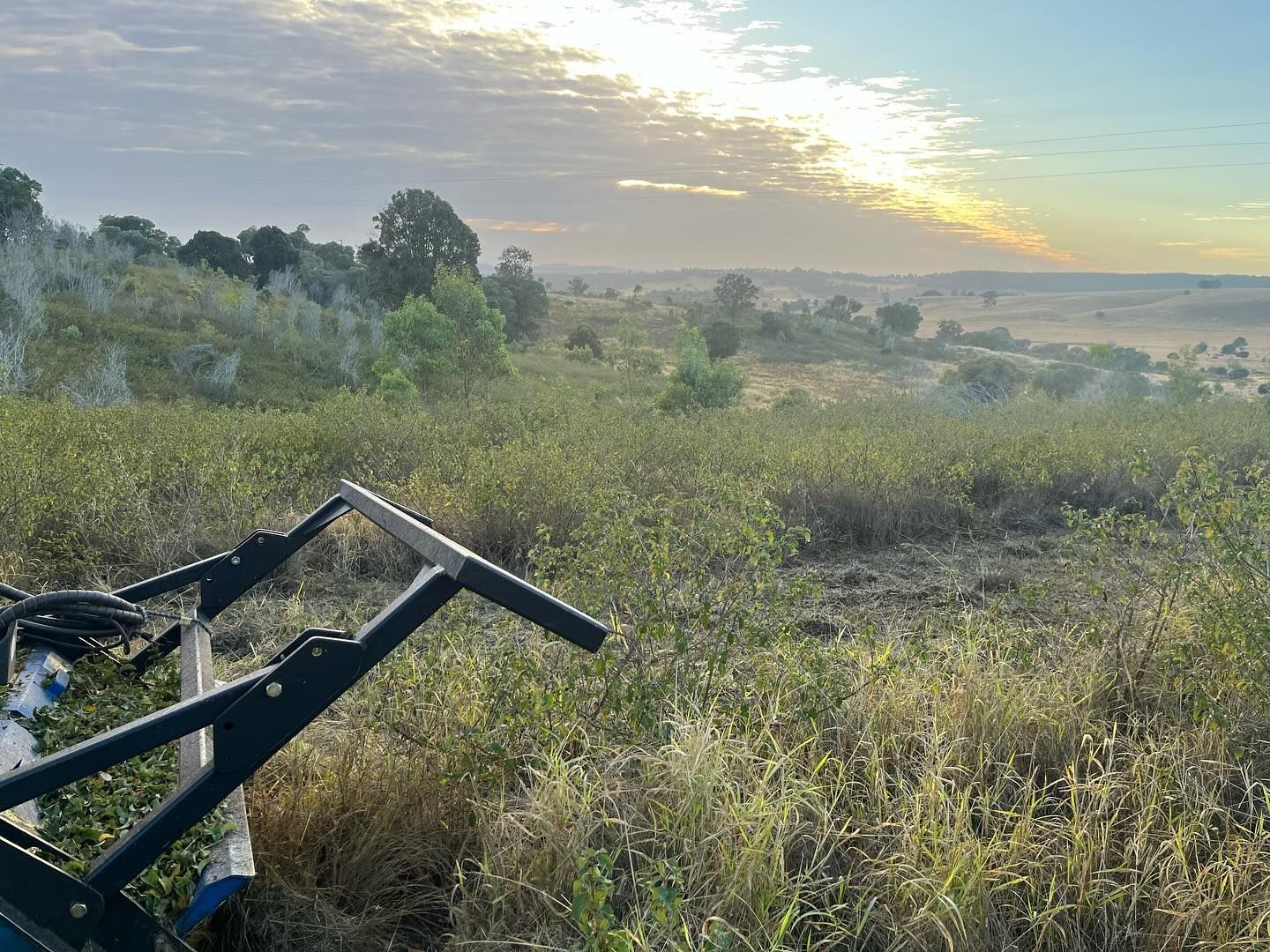 A Field at Dawn, With a Vehicle in the Foreground — Dudgeon’s Earthworks in Murgon, QLD