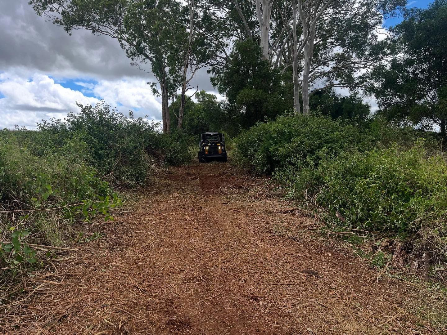 Dirt Path Leading to a Four-wheeler Among Green Bushes and Trees Under a Cloudy Sky — Dudgeon’s Earthworks in Murgon, QLD