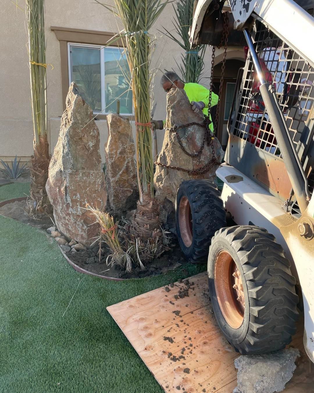 Image of landscape designers working on a hardscape project in the Coachella Valley area.