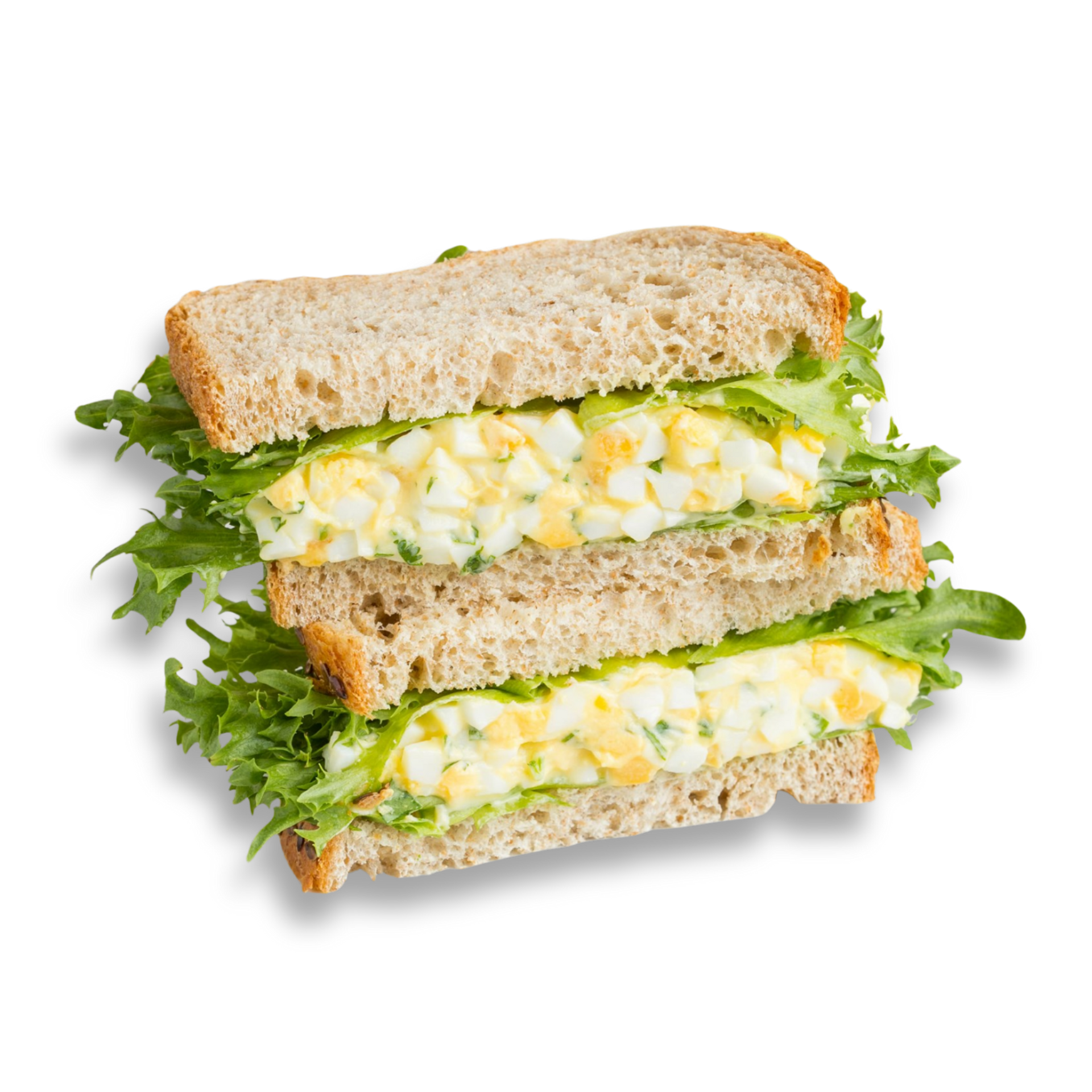 Egg salad sandwich on wheat bread with lettuce.