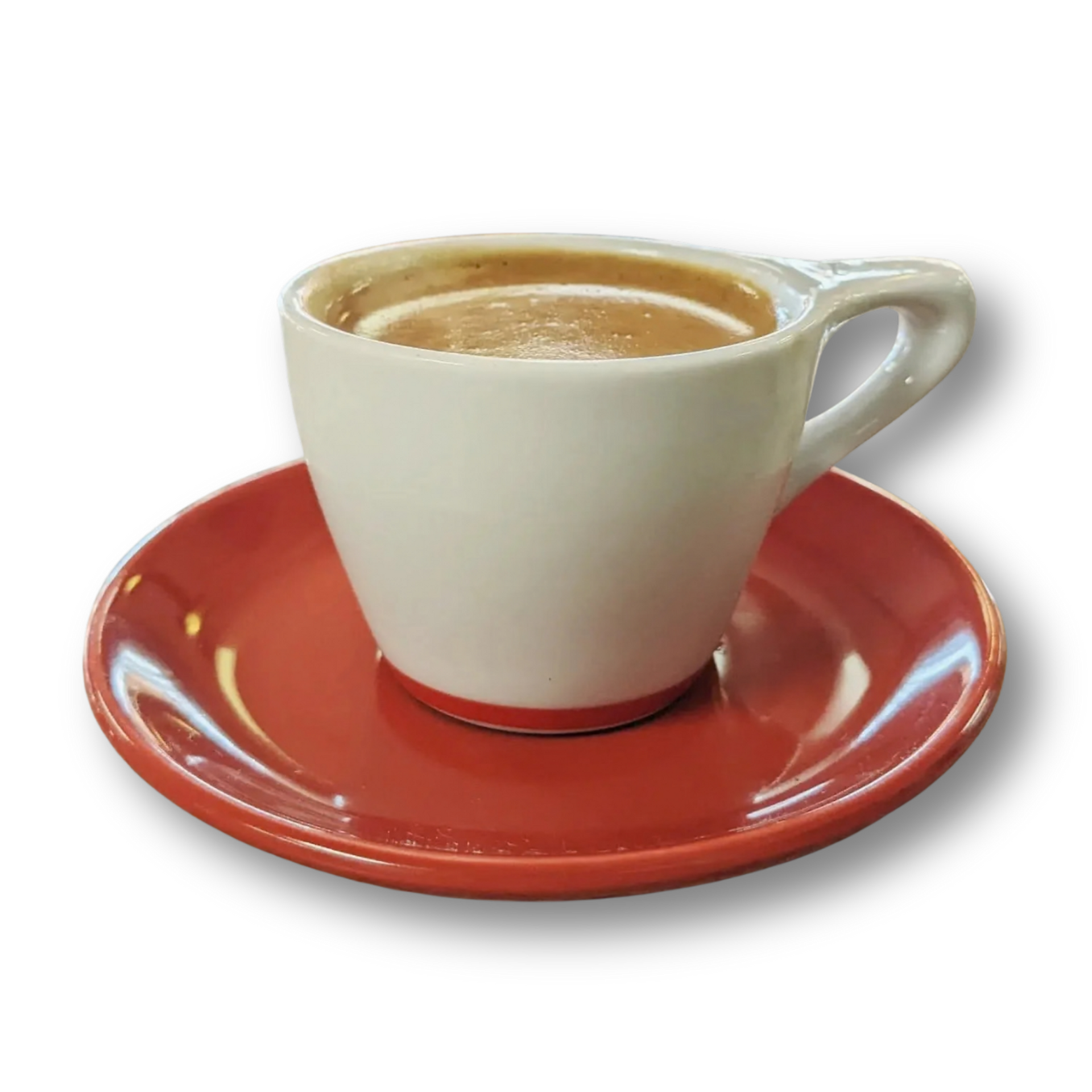 White coffee cup with coffee, on a red saucer.
