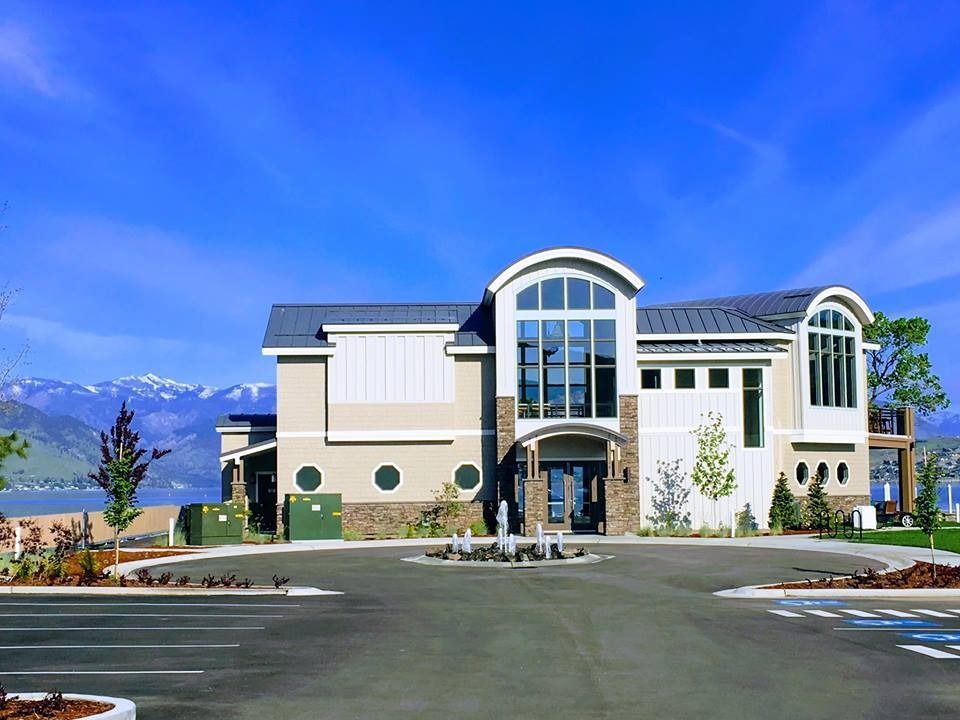 A large building with a parking lot in front of it