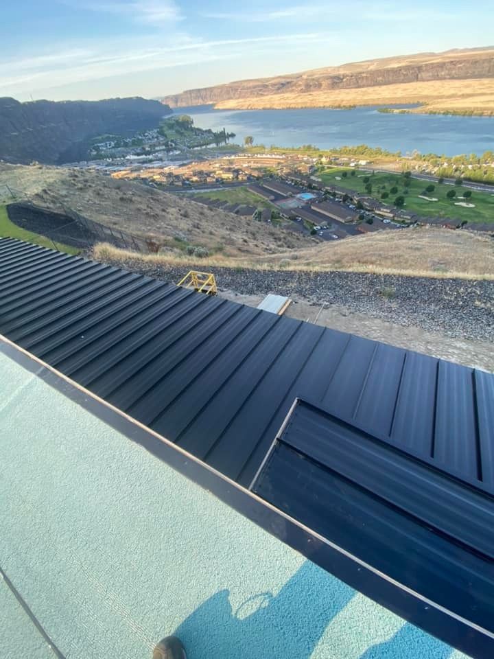 A view of a lake from the roof of a building.