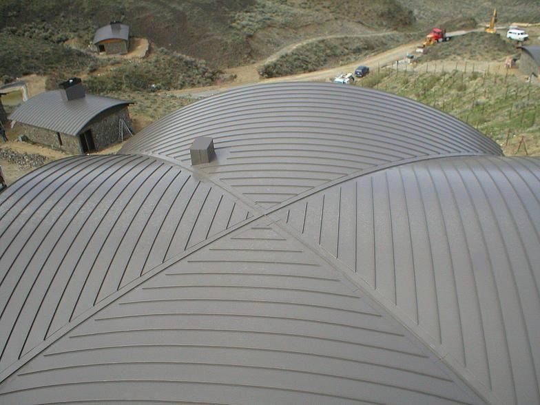 An aerial view of a dome shaped metal roof