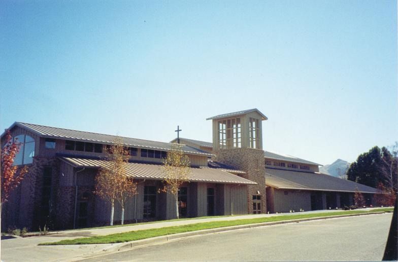 A large building with a cross on top of it