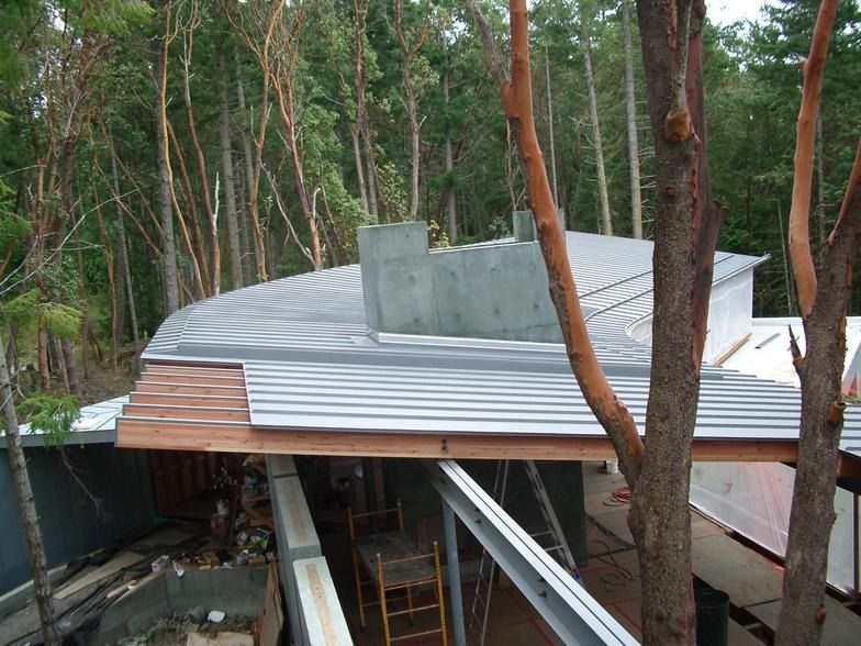 A roof is being built in the middle of a forest