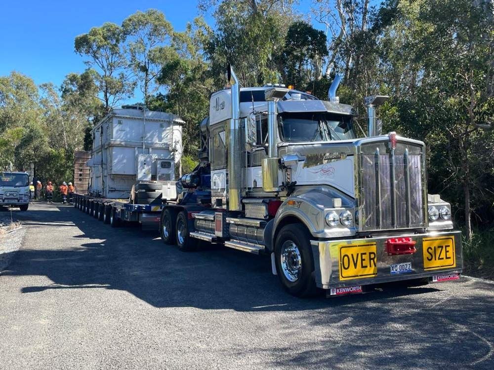 A Large Truck Hauling An Oversized Industrial Component — ECC Heavy Haulage in Ormeau, QLD