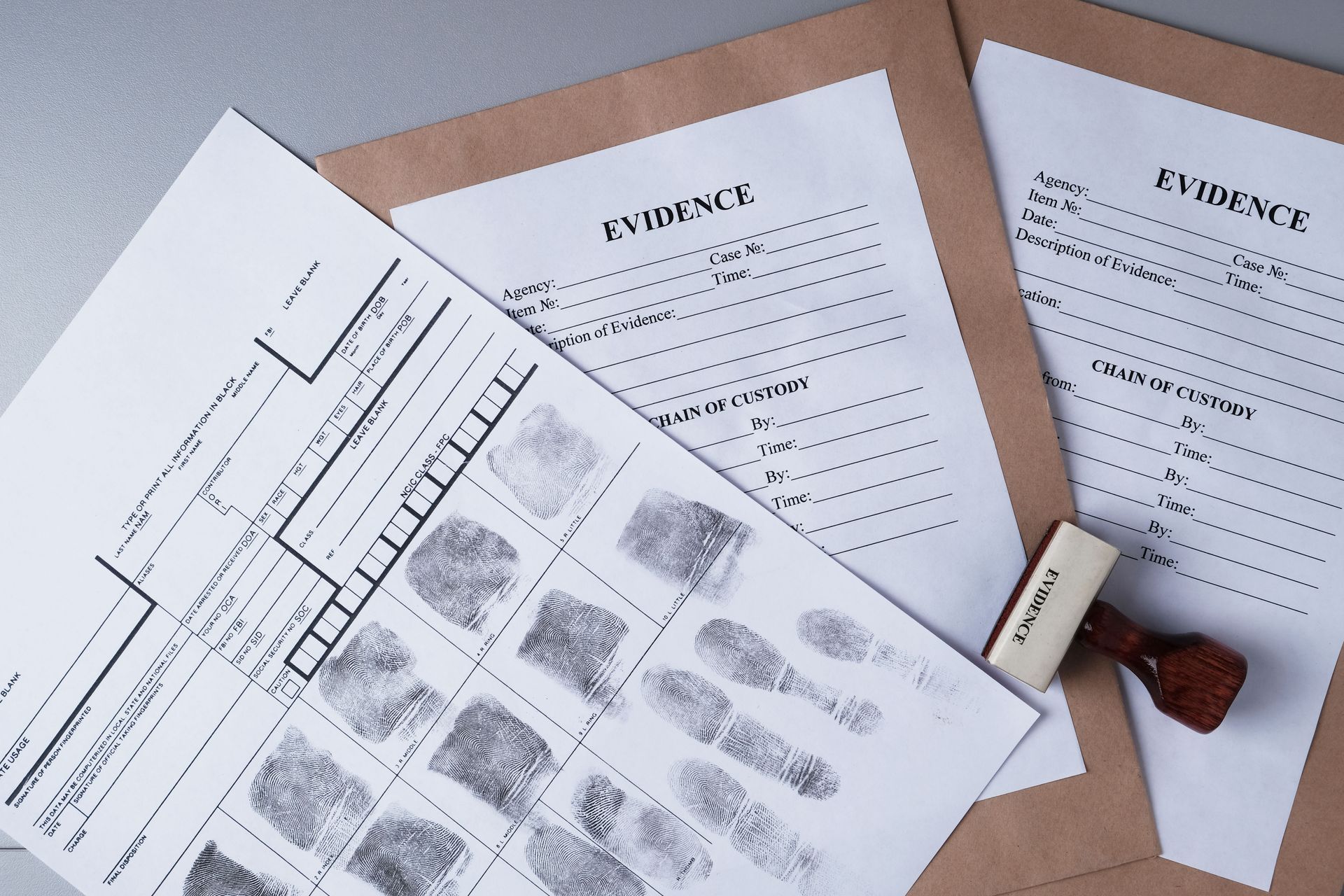 Fingerprint evidence on official documents with a stamp.