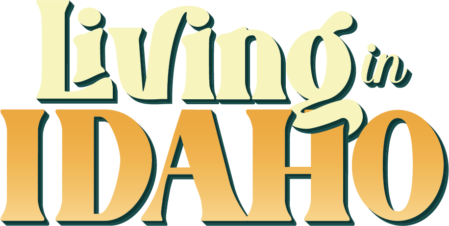 The logo for living in idaho is yellow and orange