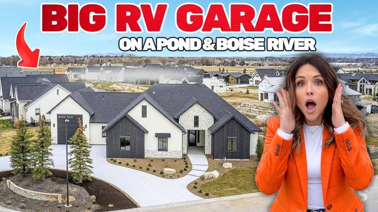 A woman in an orange jacket reacts with surprise in front of a modern house with an RV garage near a pond and river.