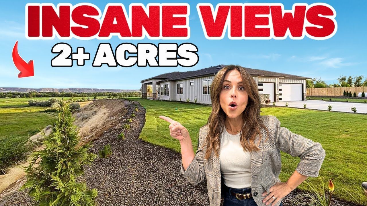 Woman pointing at a house with an open-mouthed expression. Property has open land with 