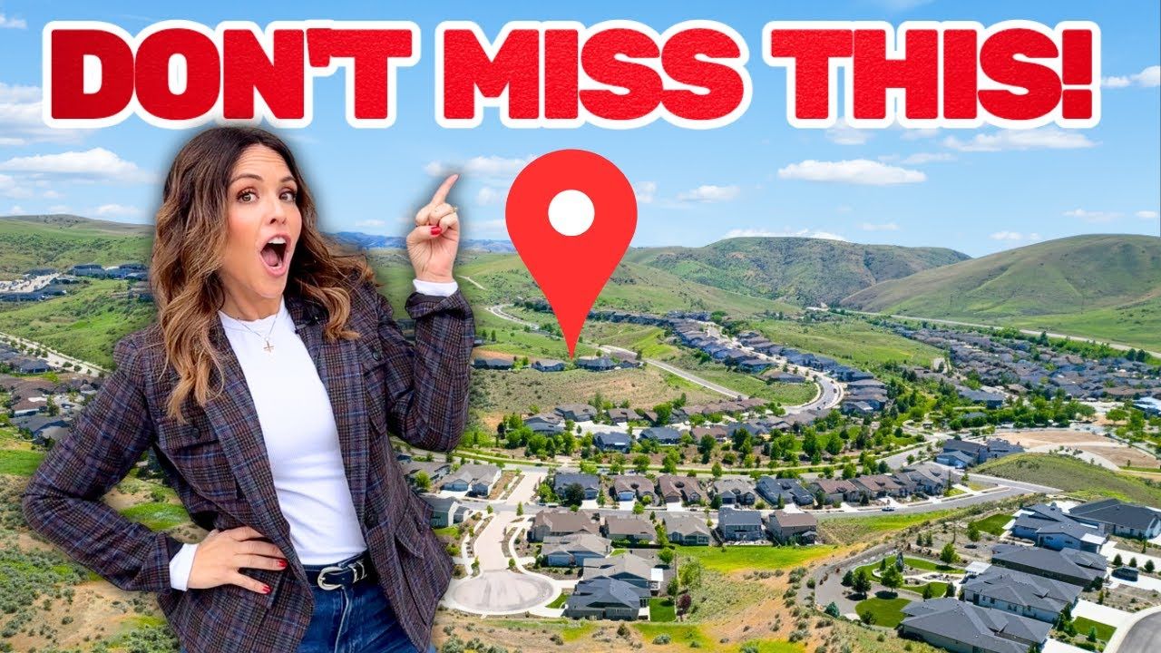 Woman pointing with surprise at a residential area in a mountainous landscape, with red 