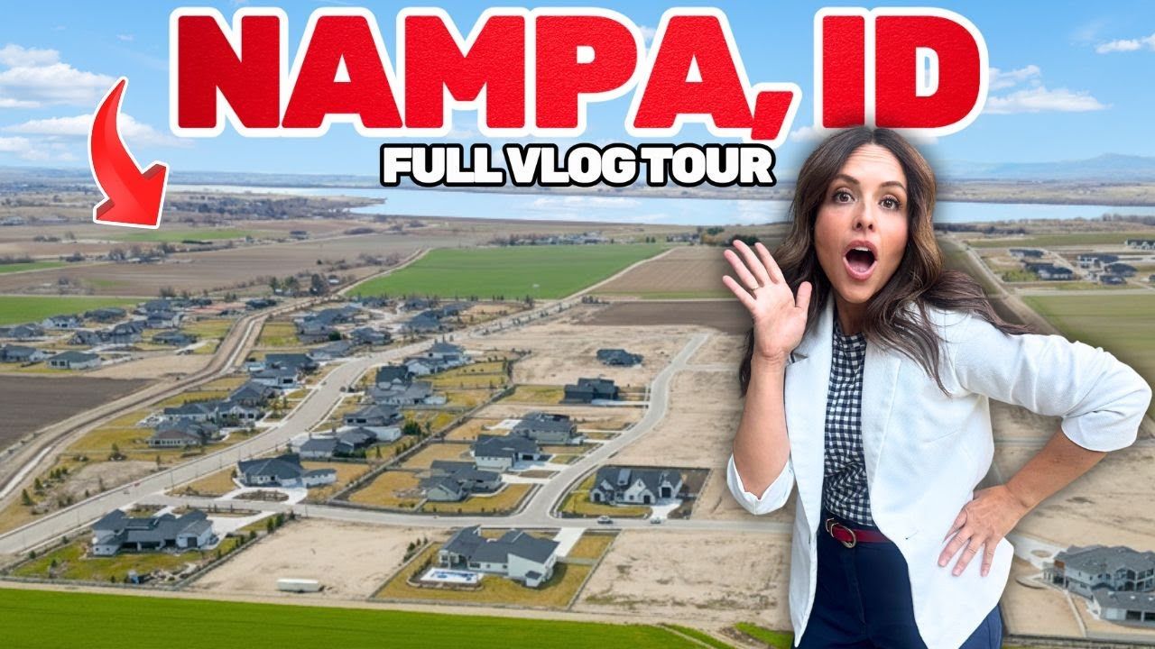 Woman waving, posing in front of new homes in Nampa, Idaho, aerial view.