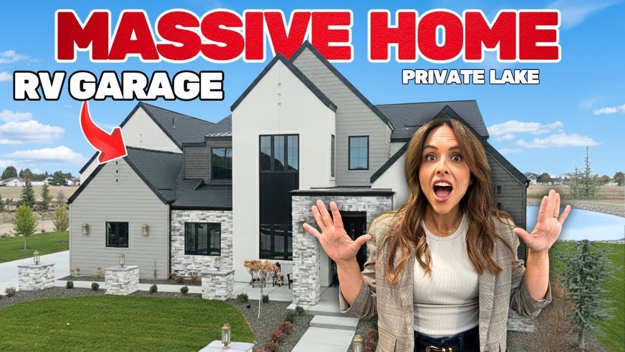 Woman with surprised expression in front of a modern home with RV garage and private lake.