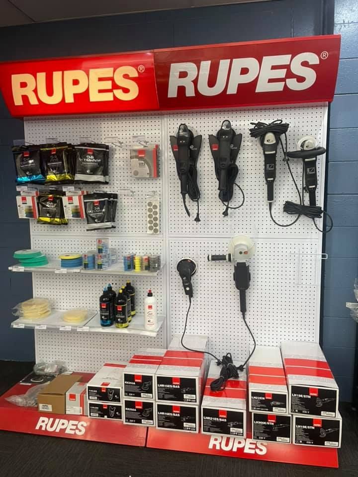 Display of Rupes detailing tools and products on a retail shelf, red and white branding.