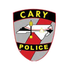 The cary police logo is a shield with a map of north carolina on it.