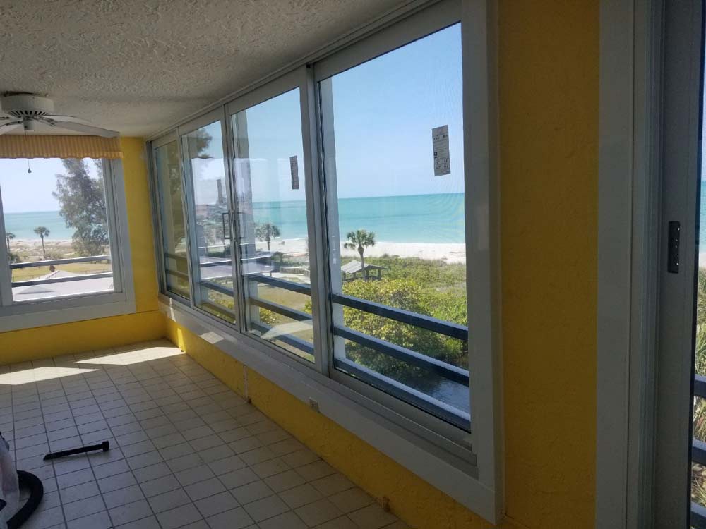 Window Work — House with yellow walls with transparent glass in Bradenton, FL