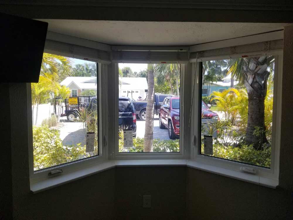 Small Window Work — Three small transparent windows with a viewing a car in Bradenton, FL