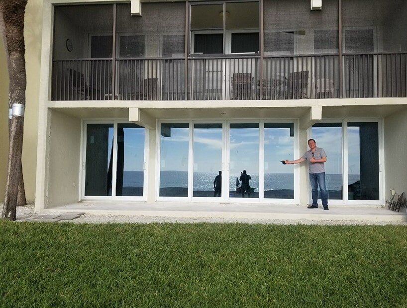 Home with New Windows and a Man in the Front — Windows in Bradenton, FL