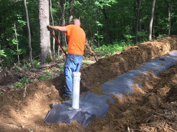 Man Fixing Pipe — Black River Falls, WI — Callahan & Son Plumbing & Septic