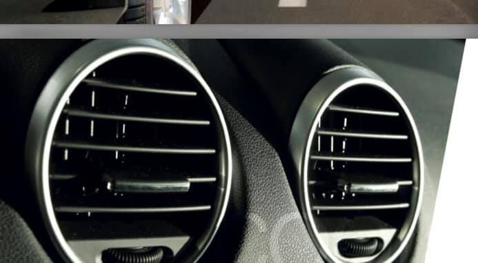 A close up of two air vents in a car