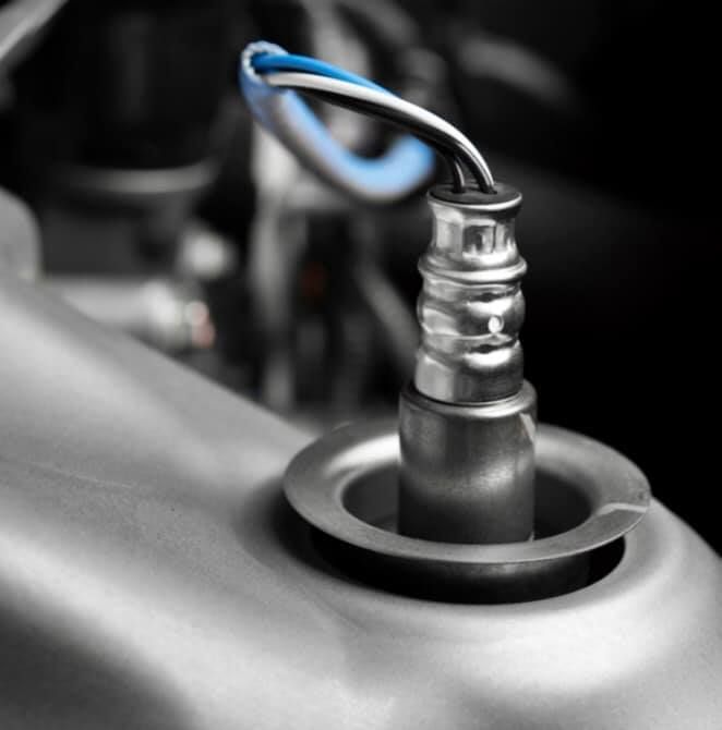 A close up of an oxygen sensor in a car