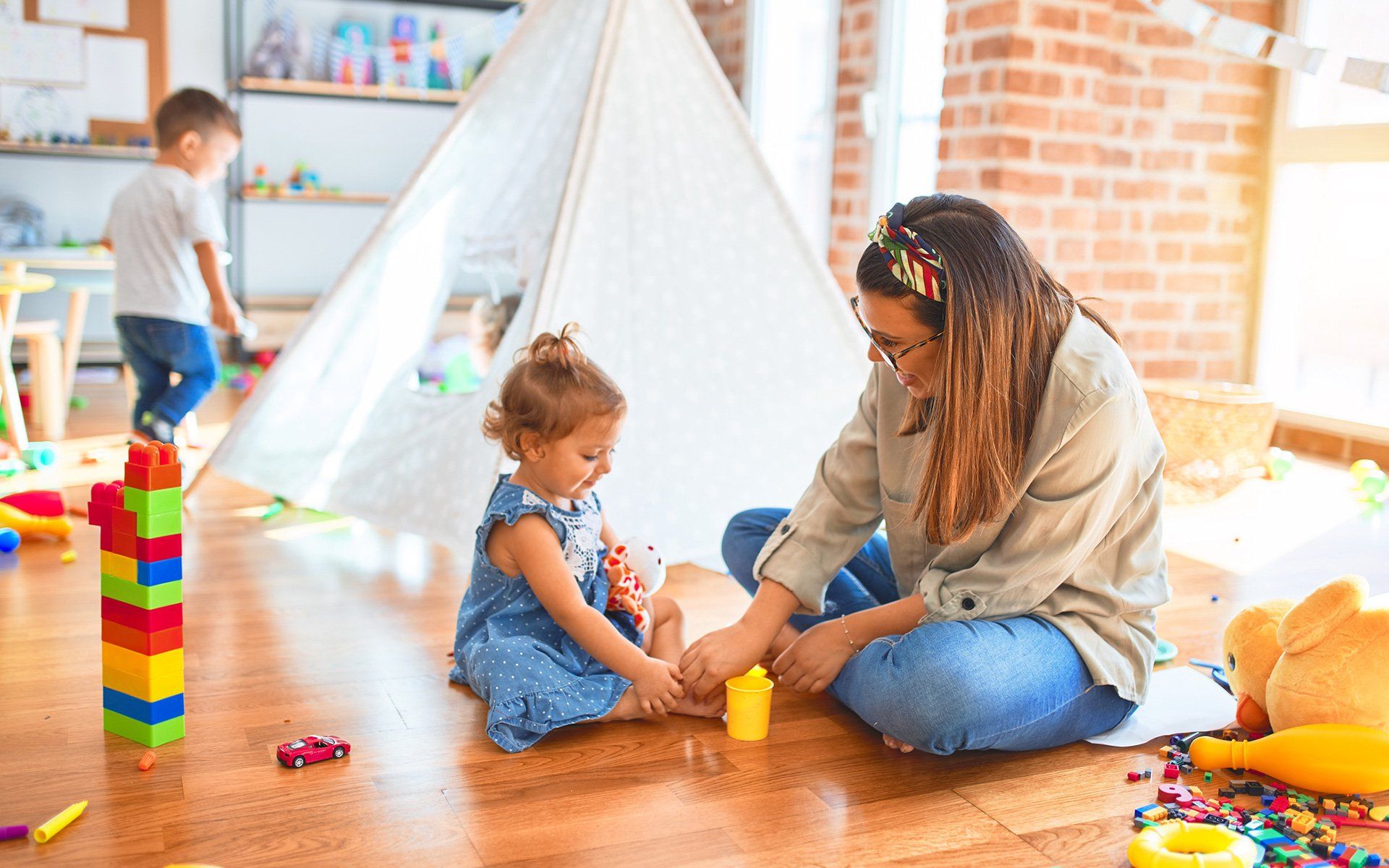 Teacher Playing With Toddler — Silverdale, WA — Central Valley Child Care