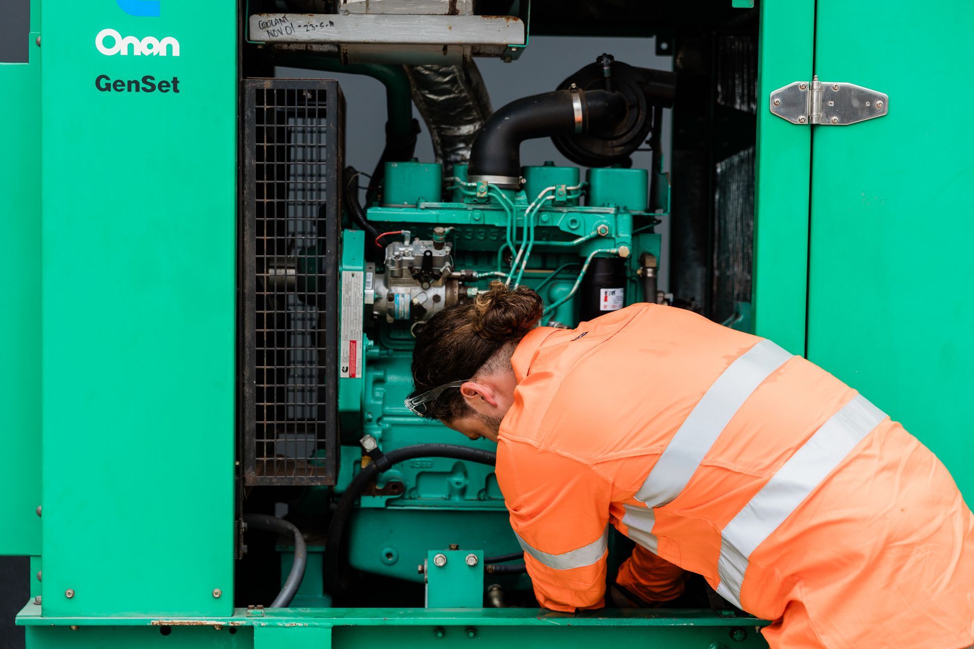A Person Works on a Green Generator — API Engineering in Charmhaven, NSW