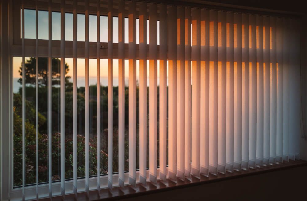 Expertly Cleaned White Vertical Blinds for Your Pristine Home — Curtain & Blind Cleaners in Bayview Heights, QLD