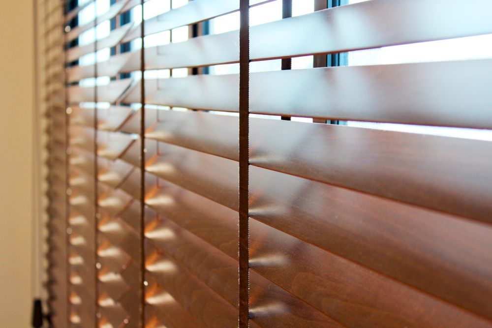 A Close Up of a Wooden Blind on a Window — Wow Clean Cairns in Redlynch, QLD