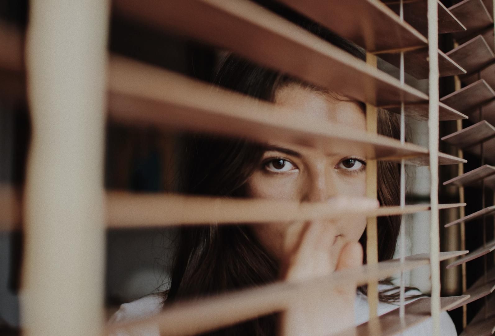 A Woman is Peeking Through the Blinds of a Window — Wow Clean Cairns in Bayview Heights, QLD