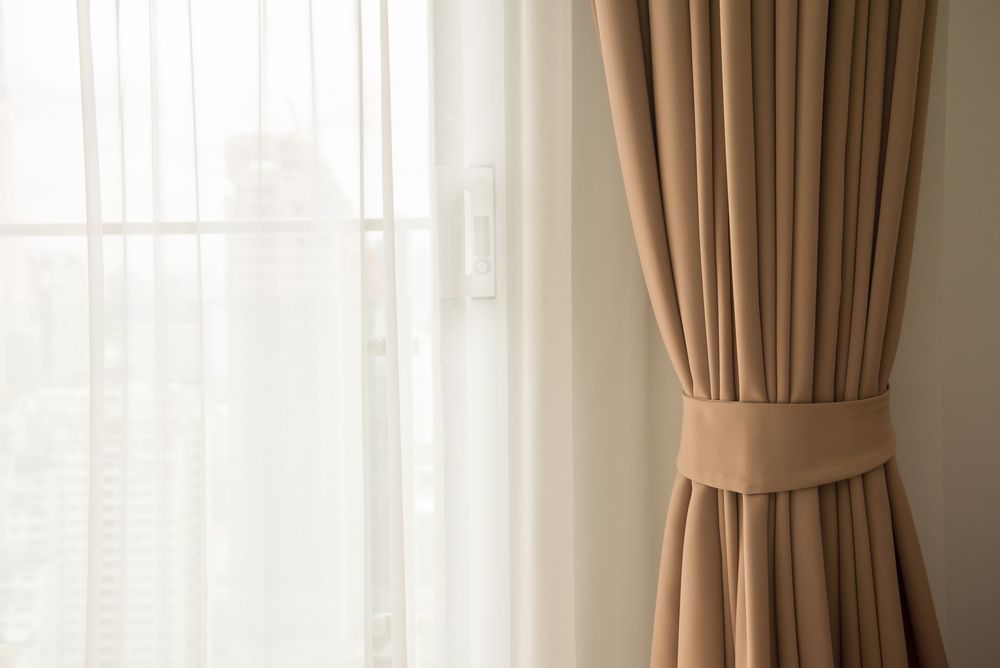 A Close Up of a Pair of Curtains Hanging on a Window — Wow Clean Cairns in Bayview Heights, QLD