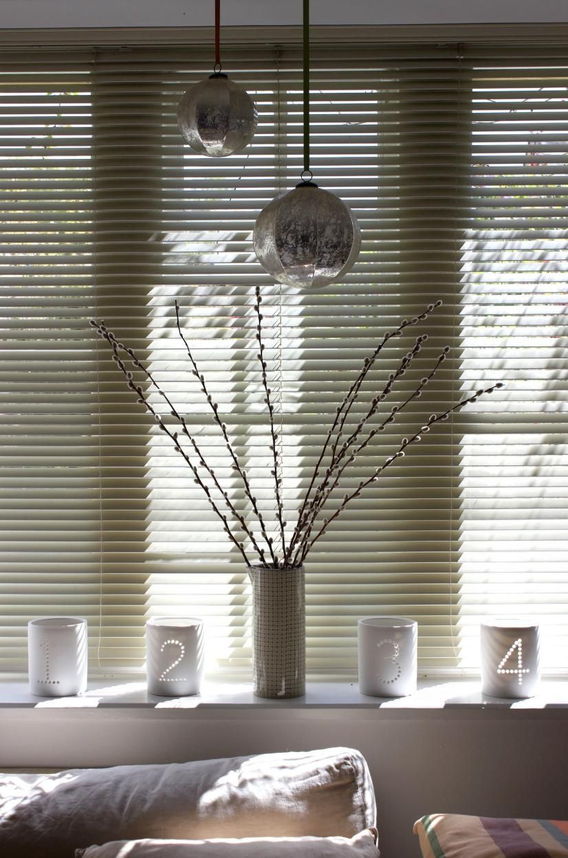 A Vase of Branches is Sitting on a Window Sill — Wow Clean Cairns in Bayview Heights, QLD
