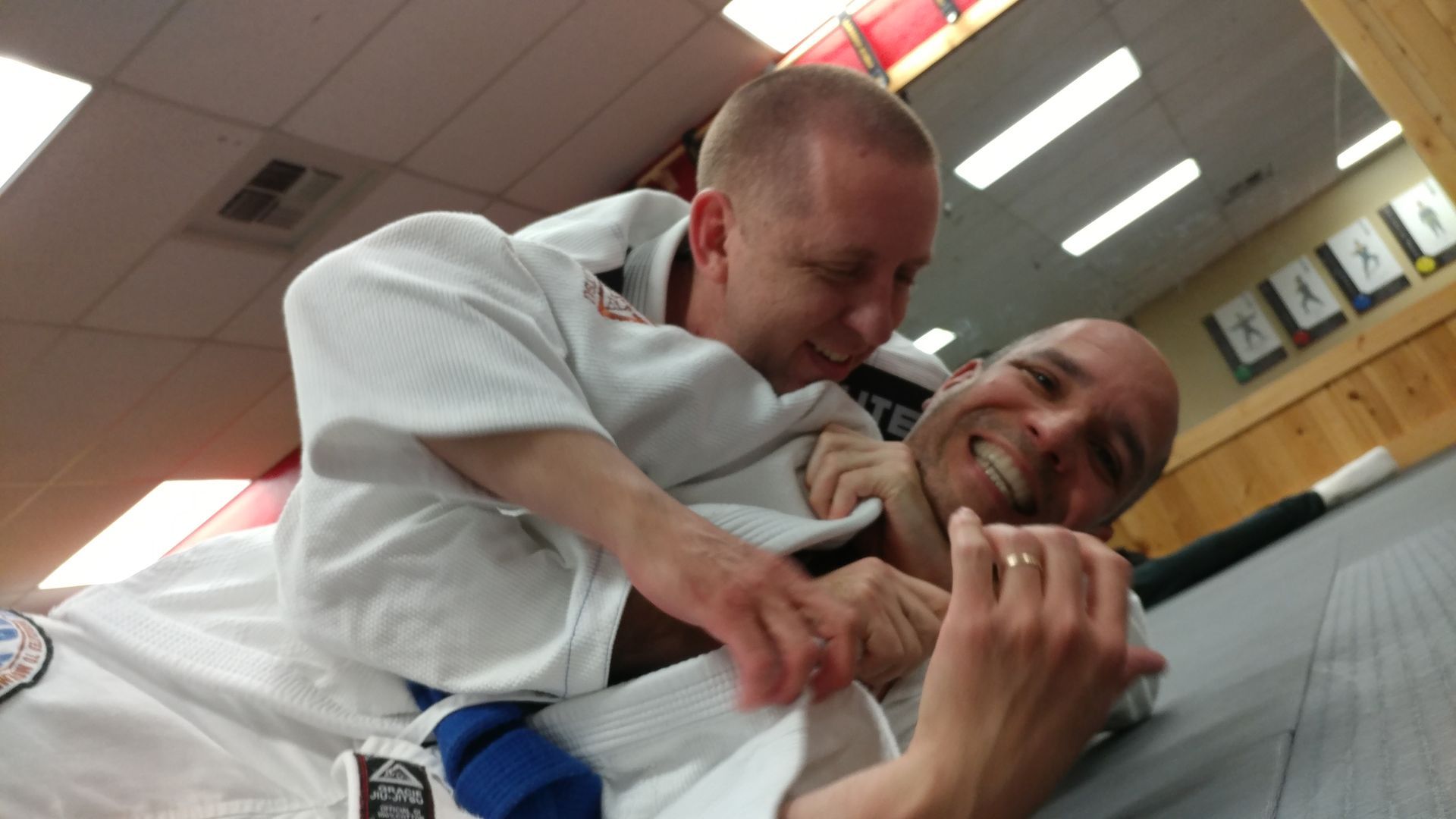 Adults drilling grappling techniques at Centerline Jiu-Jitsu Chandler in Chandler, Arizona to build strength and focus.