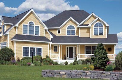 Blue Roof With Cream Colored Walls — Roofing And Siding in Toledo, OH