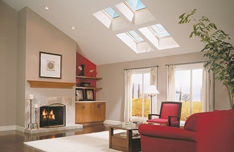 Four-Window Skylight With Red Sofa — Roofing And Siding in Toledo, OH