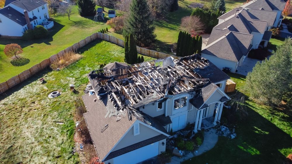 An aerial view of a house that has been damaged by a fire.