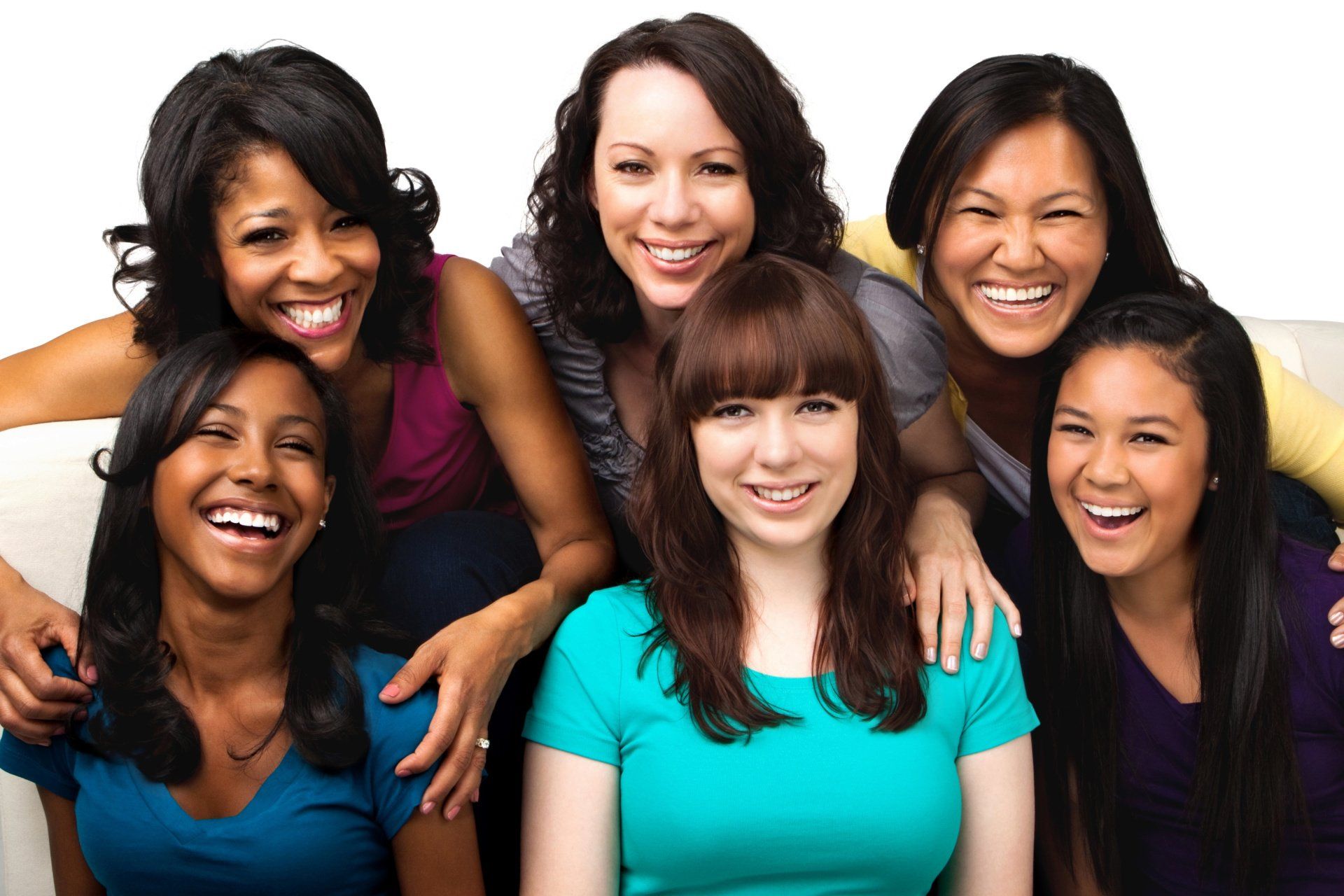 A group of women are posing for a picture together and smiling.