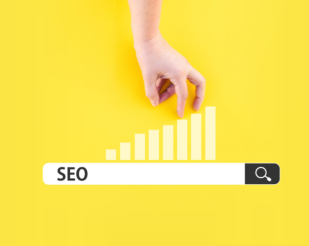 A hand is reaching for a bar with the word seo on it.