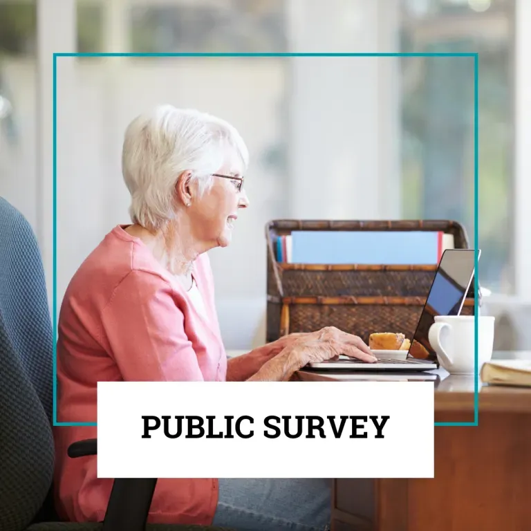 A person in a pink top sits at a desk using a laptop, overlaid with a white box containing the text 