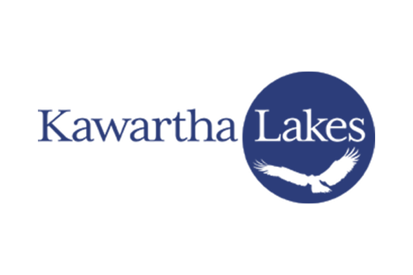 The blue and white Kawartha Lakes municipal logo featuring a stylized bird silhouette inside a circle.