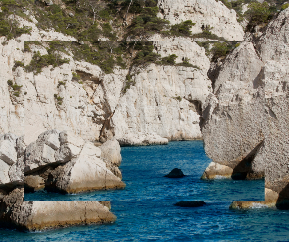 A large body of water surrounded by rocks and trees