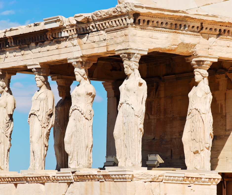 A row of statues on the side of a building