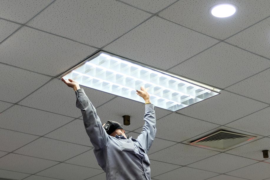 Installing Fluorescent Lamp — Electrical Services  in Jensen, QLD
