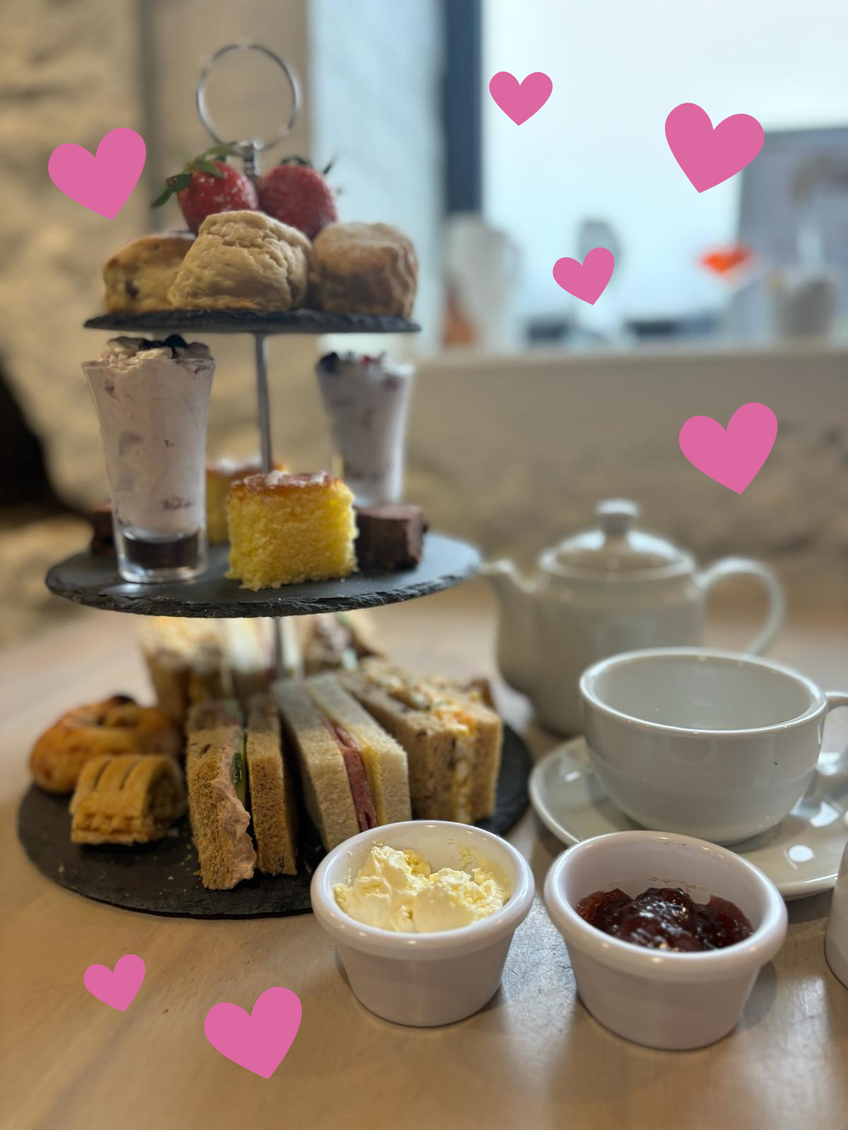 A display of food with a teapot and mug.