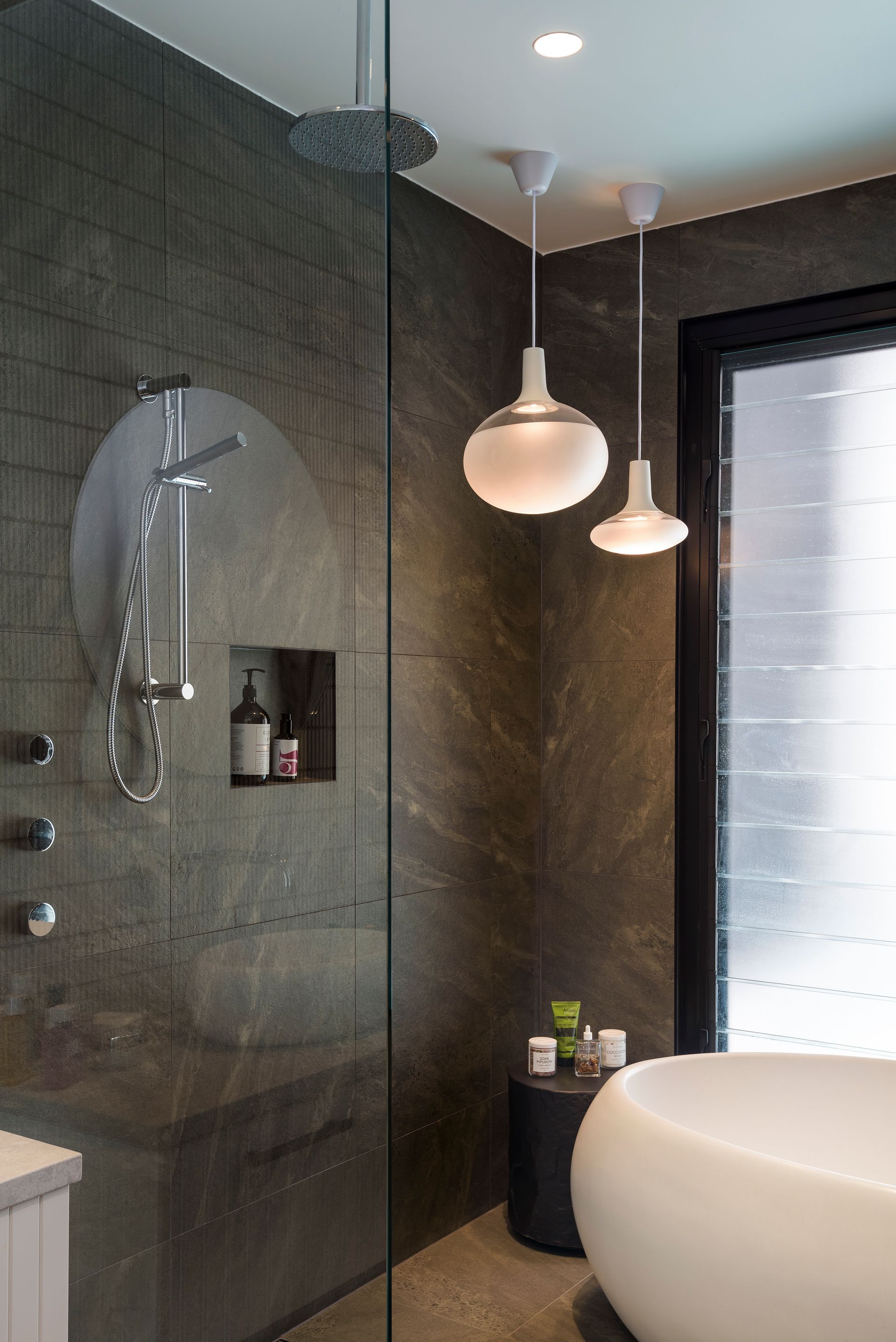 Wet-Room Style Bathroom With Mood Lighting Above A Pebble Shaped Bathtub — Star Glass Design Pty Ltd in Mayfield, NSW